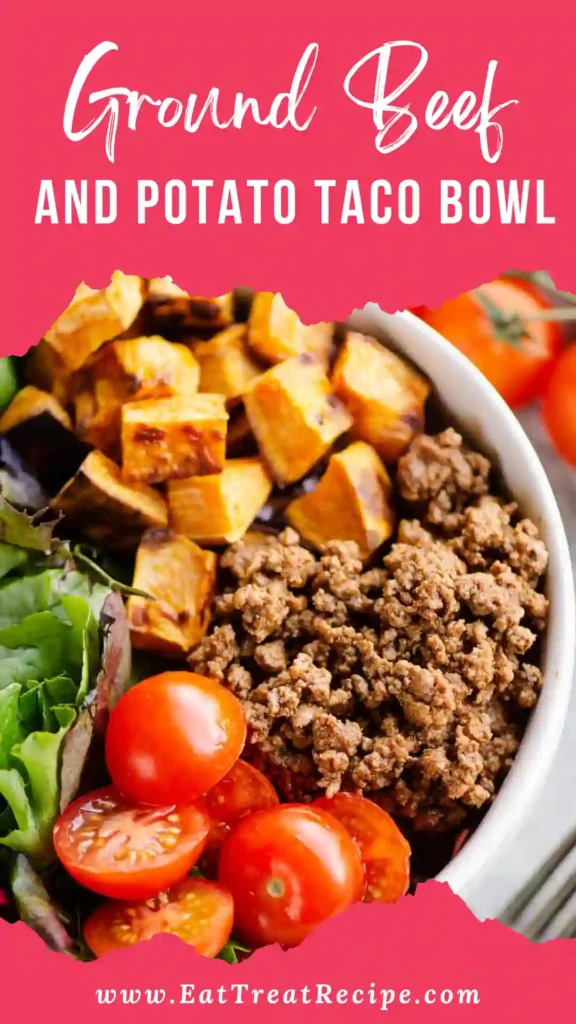Ground beef and potato taco bowl with fresh toppings served on white marble background