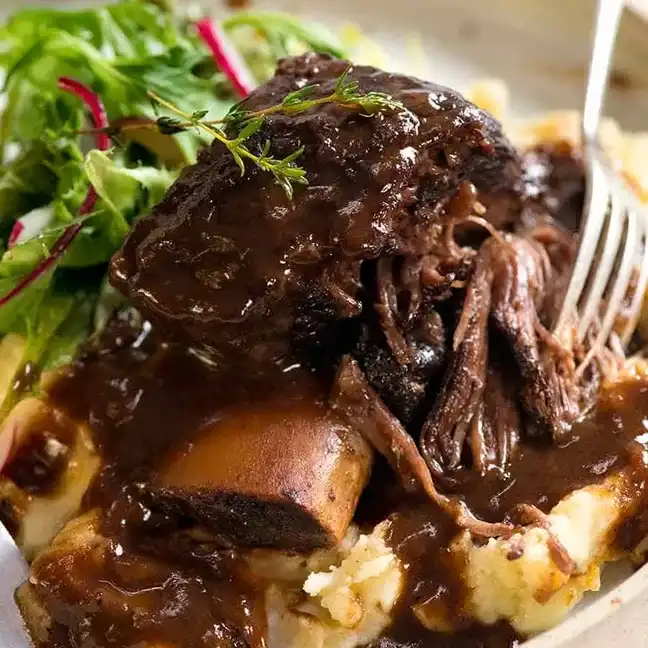 Braised Short Rib cooked in Dutch oven with rich red wine sauce