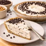 A creamy Chocolate Chip Cannoli Pie with whipped ricotta filling and mini chocolate chips in a crunchy cannoli shell crust.