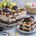 Easter Dirt Cake Casserole with Oreo soil, Peeps bunnies, and jelly beans