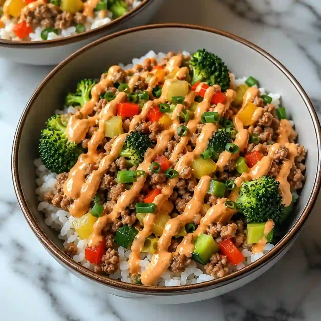Bang Bang Ground Turkey Rice Bowls served with fresh vegetables