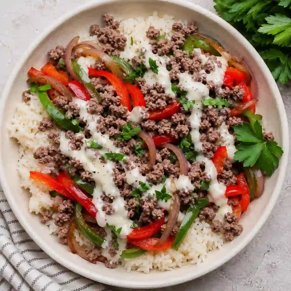 Ground Beef Philly Cheesesteak Bowl with melted provolone