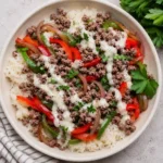 Ground Beef Philly Cheesesteak Bowl with melted provolone