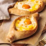 An express cheese bread boat made with store bought pizza dough on a white countertop.